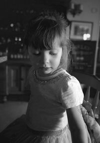 Cute girl looking at camera at home