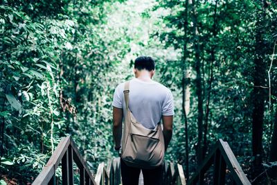 Woman standing in forest