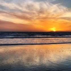 Scenic view of beach against sky during sunset