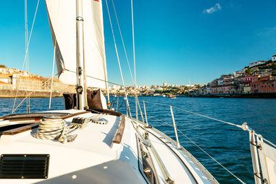 Boat sailing in sea against sky