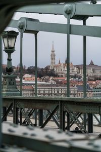 Bridge over river with buildings in background