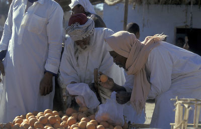 High angle view of people working on table