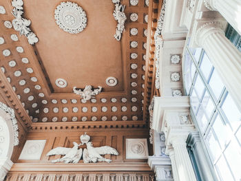 Low angle view of statue hanging in building