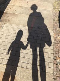 Shadow of people on street