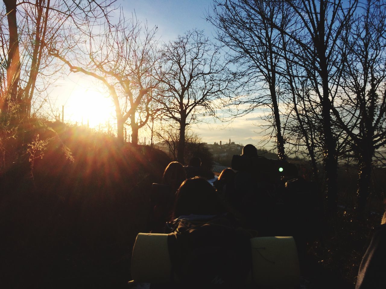 real people, men, sitting, outdoors, large group of people, nature, leisure activity, sky, tree, togetherness, day, people