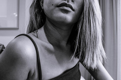 Close-up portrait of beautiful woman at home