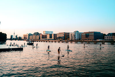 Scenic view of sea with buildings in background