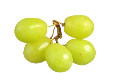 Close-up of fresh grapes against white background