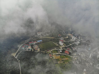 High angle view of buildings in foggy weather