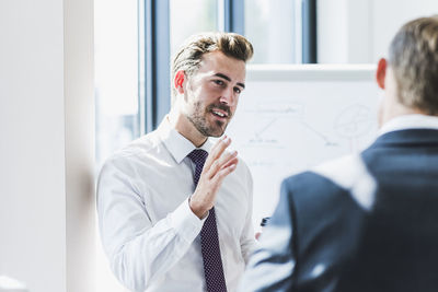 Two businessmen discussing in office