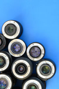 High angle view of lens on blue background