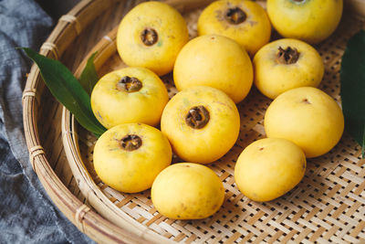 High angle view of fruits in basket on table