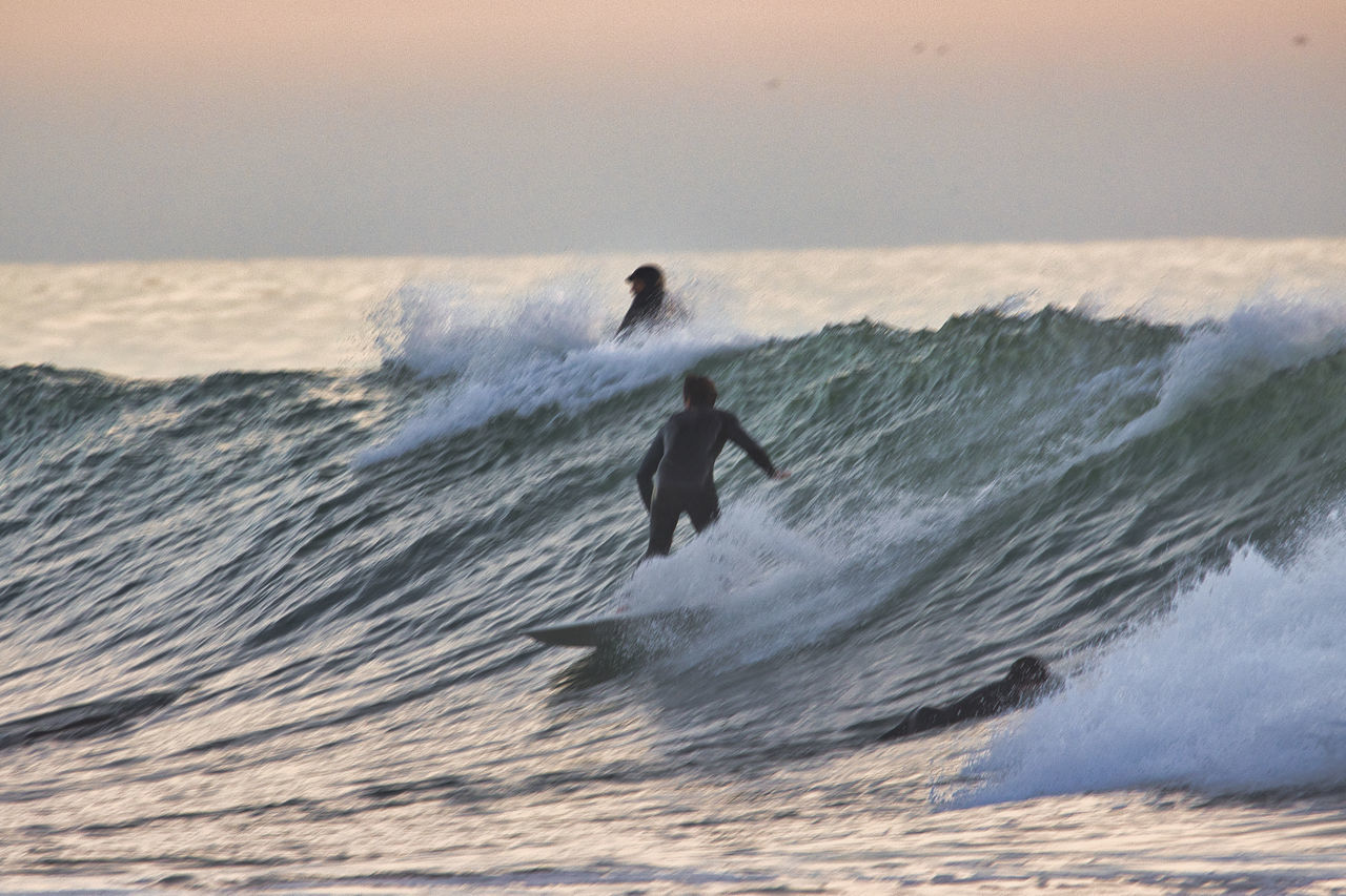 MAN SURFING IN SEA