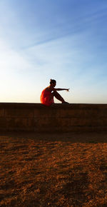 Man standing against sky during sunset