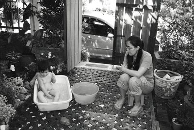 Young woman sitting outdoors