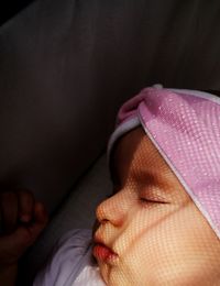 High angle view of baby girl sleeping