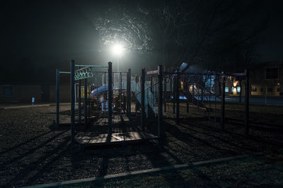 View of illuminated street lights at night