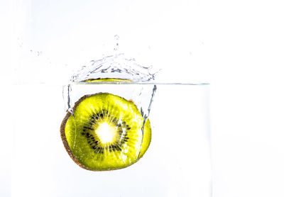 Close-up of glass over white background