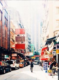 Woman standing on city street