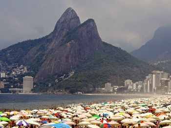 Tourists and umbrellas on beach