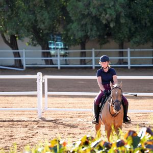 Full length of man riding horse