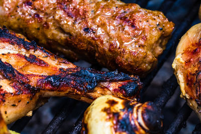 High angle view of meat on barbecue grill