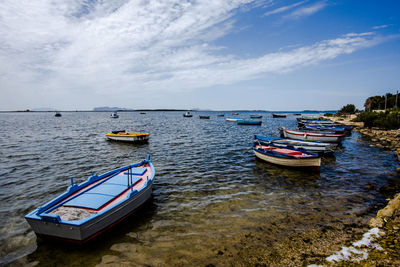 Small colorful fishing boats at the laguna dello stagnone marsala trapani sicily italy