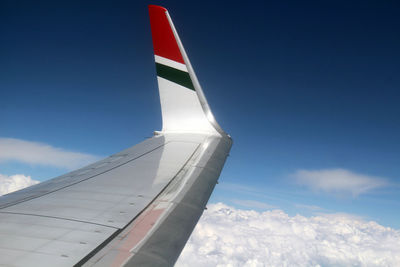 Low angle view of airplane flying in sky