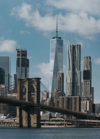 View of skyscrapers against cloudy sky