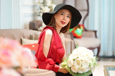 Portrait of woman with red roses