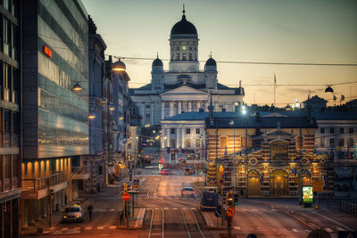 Vehicles on road along buildings