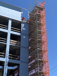 Low angle view of construction site against sky