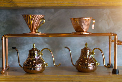 Close-up of various food on table against wall