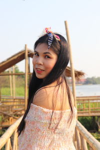 Portrait of smiling woman standing outdoors