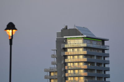 Low angle view of illuminated building against sky