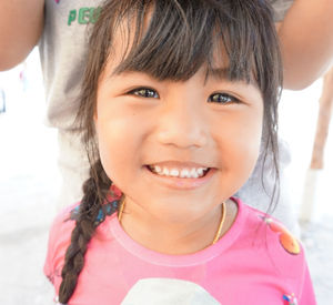 Close-up portrait of a smiling girl