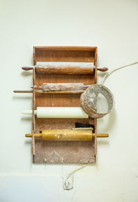 Four traditional rolling pins on a bakery rack in belgrade, serbia