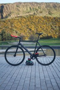 Bicycle parked on footpath in city