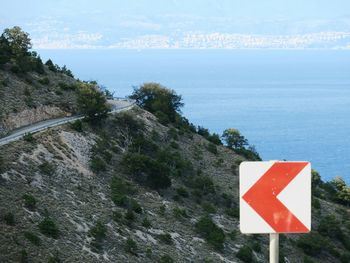 Road by sea against sky