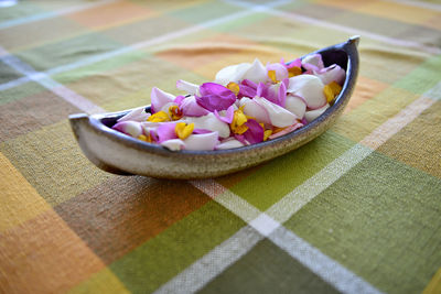 High angle view of purple flowers in bowl on table