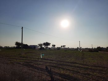 Scenic view of field against sky during sunset