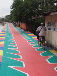 Man riding bicycle on street