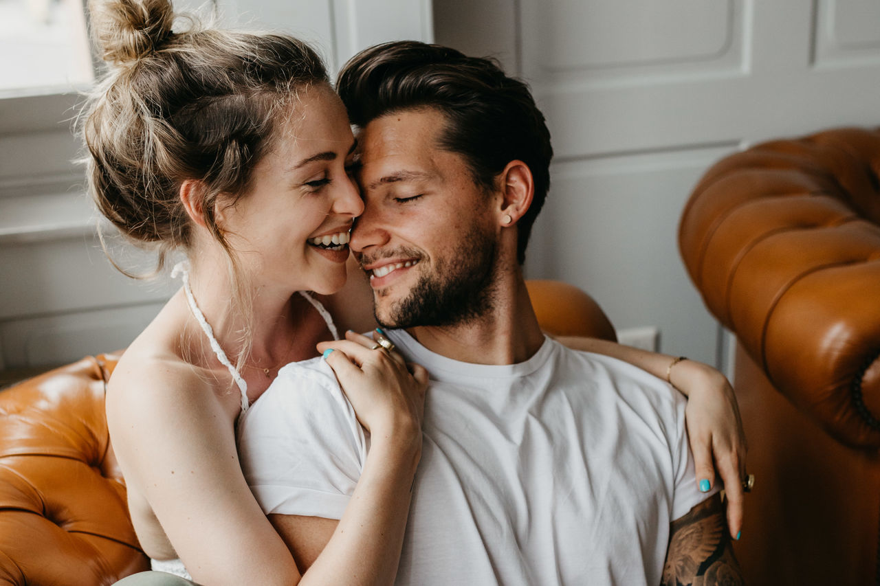 Loving young couple romancing at home