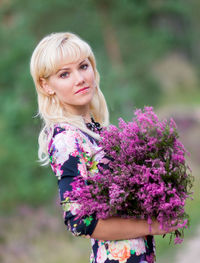 Portrait of a beautiful young woman standing outdoors