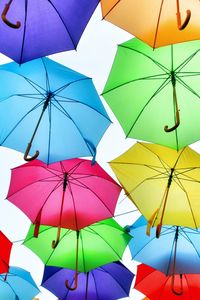 Low angle view of umbrellas hanging on umbrella