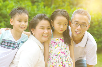 Close-up of happy family against plants