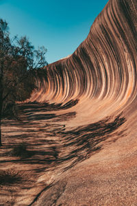 Rock formations on landscape against sky