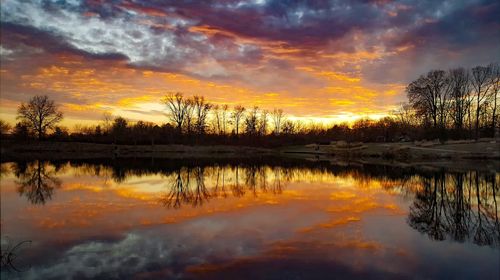 Scenic view of lake against sky during sunset