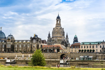 Historic buildings in city against sky