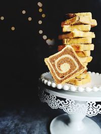 Close-up of cupcakes on table against black background